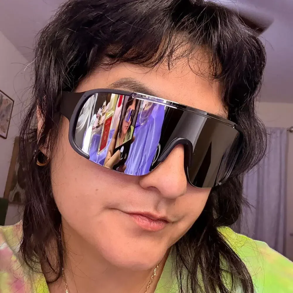 Unisex Black mirrored shield sunglasses with a sleek futuristic wraparound fit